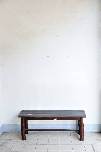 istock Brown wooden bench on white wall scene. 168773190