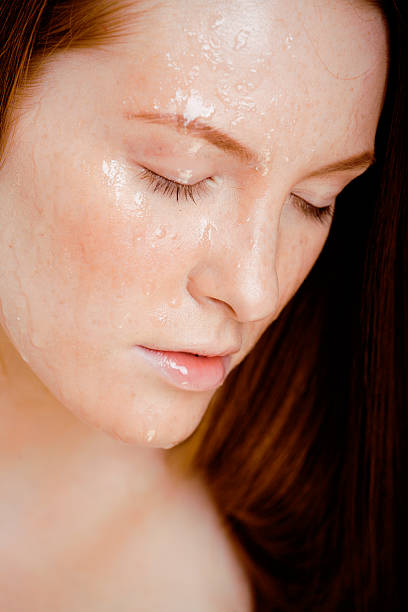 istock red hair woman with drops on her face 168773632