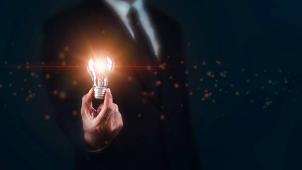 istock Businessman holding Bright light bulb. Ideas,innovative,technology and creativity concept. 1687757208