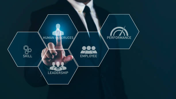 istock Businessman touching virtual screen and choosing human resources concept against dark background. 1687757216
