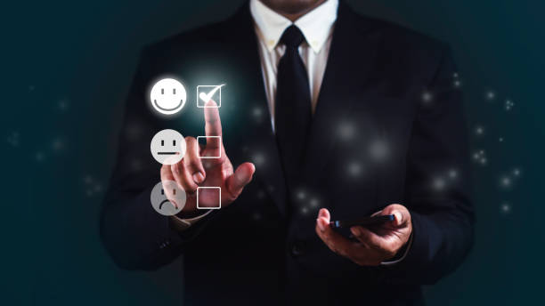 Businessman is using smartphone and choosing most satisfied. Customer review satisfaction feedback survey concept.