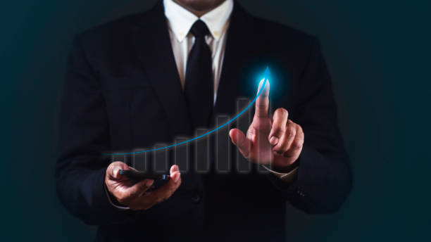istock Businessman is using smartphone and drawing growth virtual of statistics, graph and chart. 1687760915