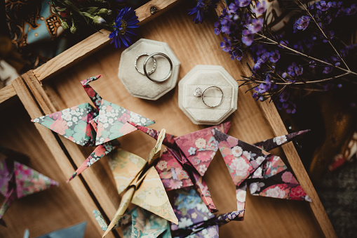 Whimsical wedding rings with origami birds