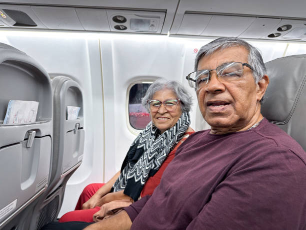 istock Elderly people on the plane 1687790674