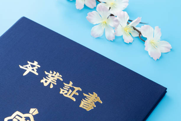 istock Diploma and cherry blossoms on blue background. 1687790727