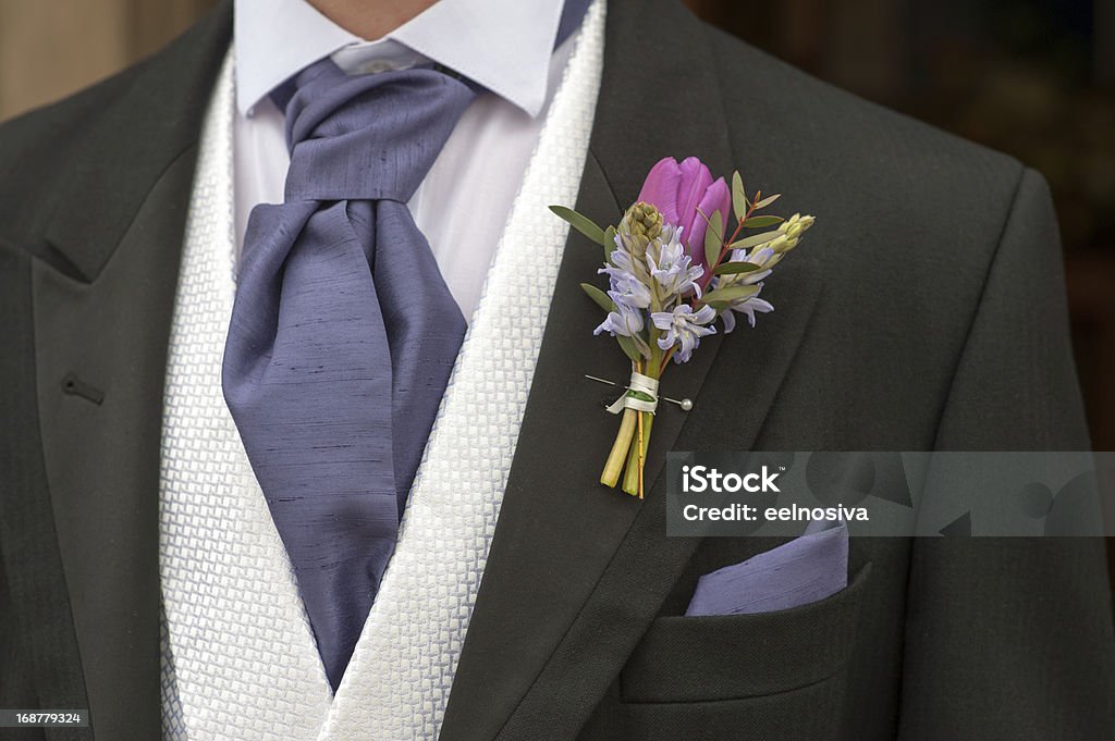 groom with purple flower buttonhole Adult Stock Photo