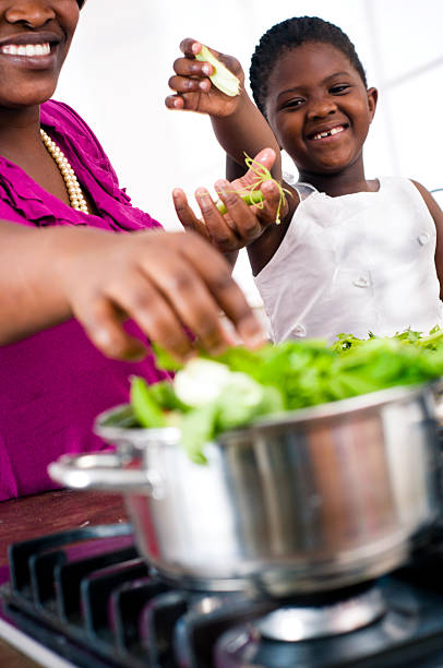 istock Mother and daugter cooking 168781175