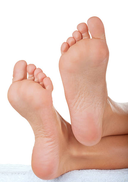 istock The bottom of a woman's feet isolated on white 168781533