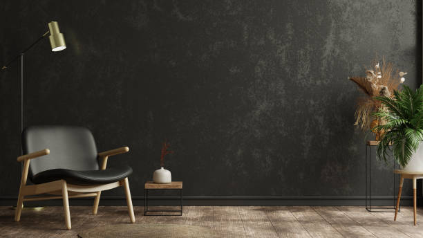 istock Style loft interior with black leather armchair on dark cement wall. 1687816394