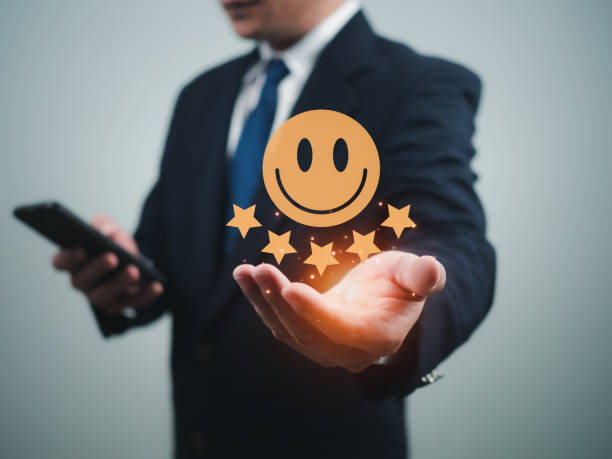 istock Businessman using the phone to check customer service. Customer satisfaction survey concept, service experience evaluation, customer evaluation product service quality, satisfaction feedback review 1687822310
