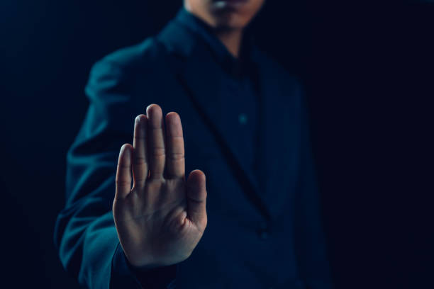 istock Man hand showing palm gestures stop 1687837347