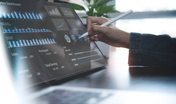 istock Businessman using digital tablet analyzing sales data and financial growth graph chart report. Business planning, strategy and development. Financial and banking. market research, data analysis 1687847475