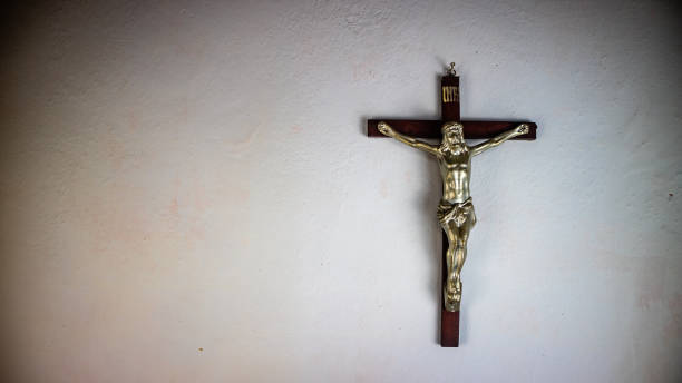istock a cross hung on a white wall 1687864772