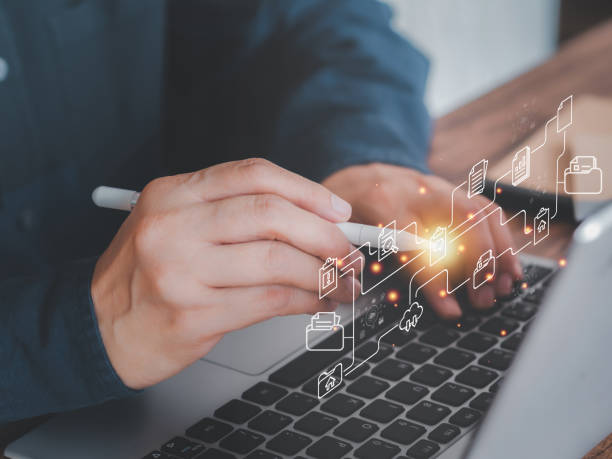 istock Businessman working on laptop with stylus pen shows the virtual screen with icon document data technology 1687865145