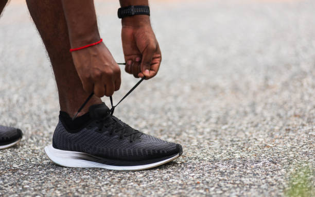 istock runner black man standing he trying shoelace running shoes 1687879826