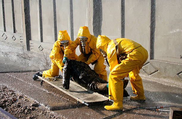istock man in a yellow chemical protection suit 168788871