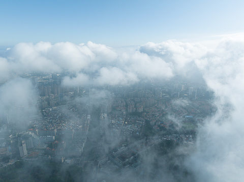 Cityscape under advection fog
