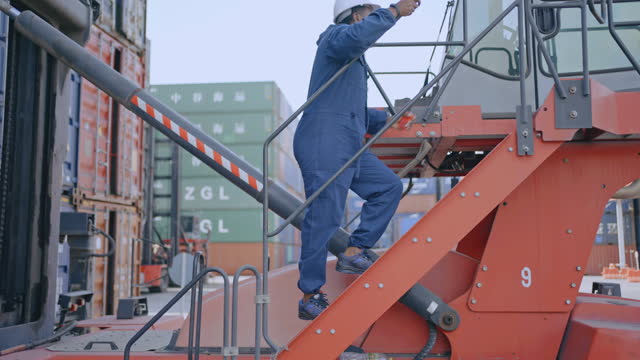 Container dockers working in Shipping Container cargo.