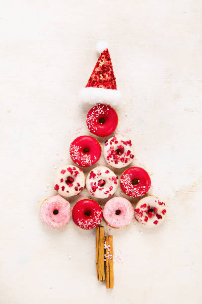 istock Christmas tree made of sweet donuts. Top view, flat lay on light background 1687899585