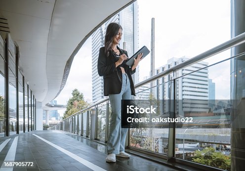 istock Millennial digital nomads work remotely, using laptops to connect , create content on the move. 1687905772