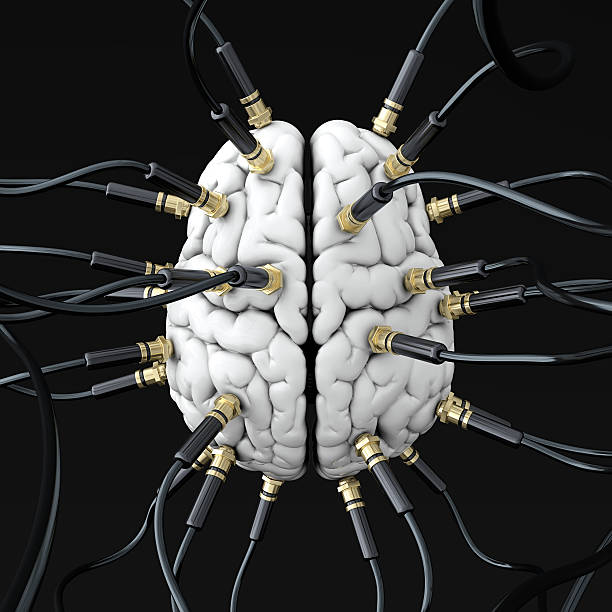 istock Upper view of several black wires connected to a white brain 168790627