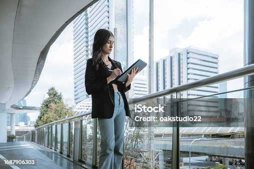 istock Millennial digital nomads work remotely, using laptops to connect , create content on the move. 1687906303
