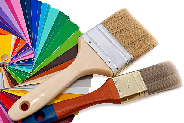 paintbrushes and color samples stock photo