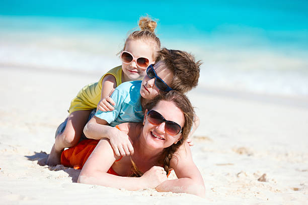 istock Beautiful family on a beach 168790653