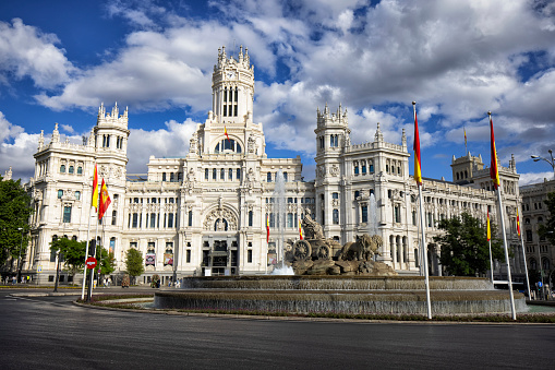 Street view of Palace of Communication on the Plaza de Cibeles in Madrid, Spain. Fountain of La Cibeles in the front.