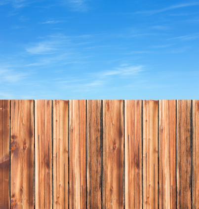 Wooden fence with blue sky background
