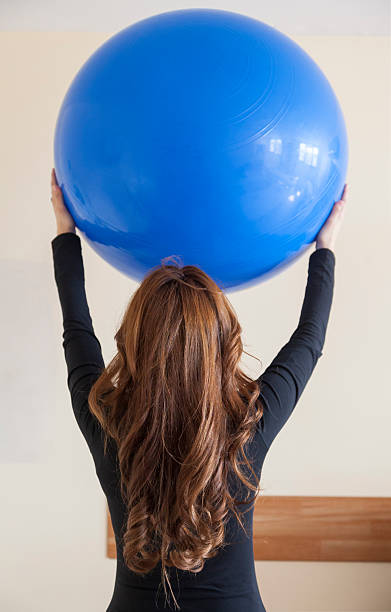 istock Physical therapy young woman 168792131