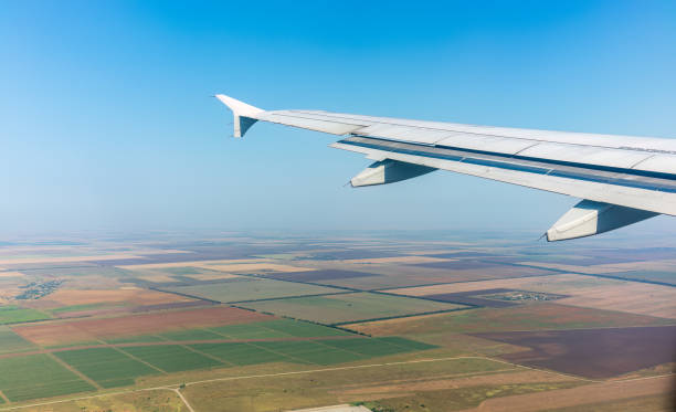 istock View from the airplane window during taking off on a clear summer morning 1687924139