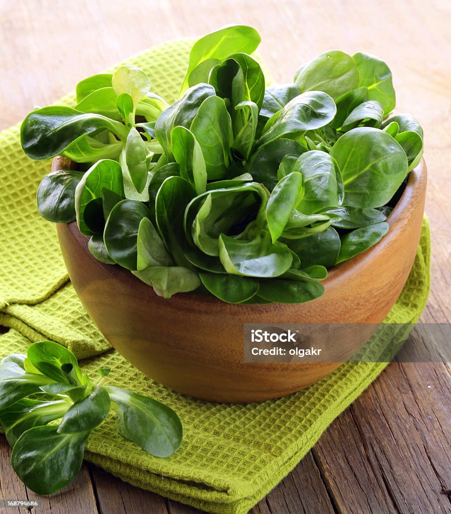 Fresh green salad valerian in a wooden bowl Appetizer Stock Photo