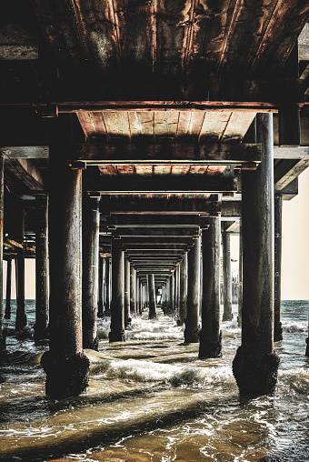 The Santa Monica Pier is a large pier at the foot of Colorado Avenue in Santa Monica, California, United States. It contains a small amusement park, concession stands, and areas for views and fishing.