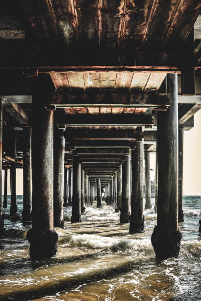 waters underneath santa monica pier, california - santa monica beach beach california wave imagens e fotografias de stock