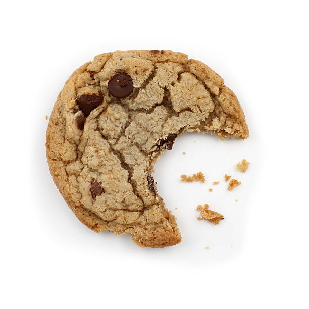 Chocolate Chip Cookie Chocolate chip cookie with a missing bite. chocolate chip cookie top view stock pictures, royalty-free photos & images