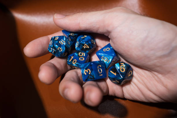 Hand holding various kind of dices