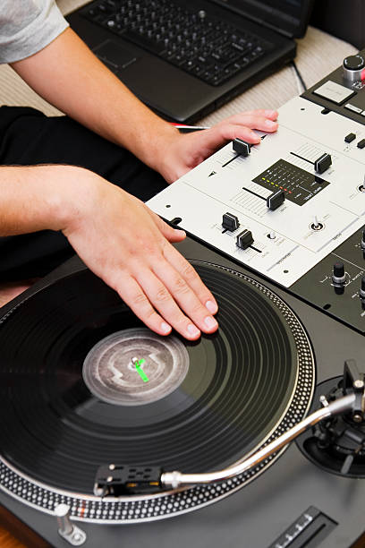 istock Hip-hop DJ scratching the vinyl record 168797765