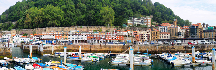 Santiago Plaza is a hidden gem in Pasaia Donibane, Spain, near San Sebastian. Nestled in this charming Basque fishing village, it is a picturesque riverside square lined with colorful buildings.