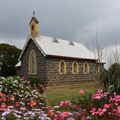 Old bluestone Church with cottage garden