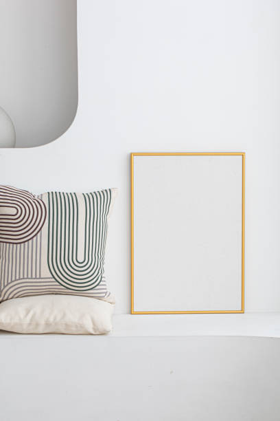 istock Blank picture frame mockup on a wall. 1687994394