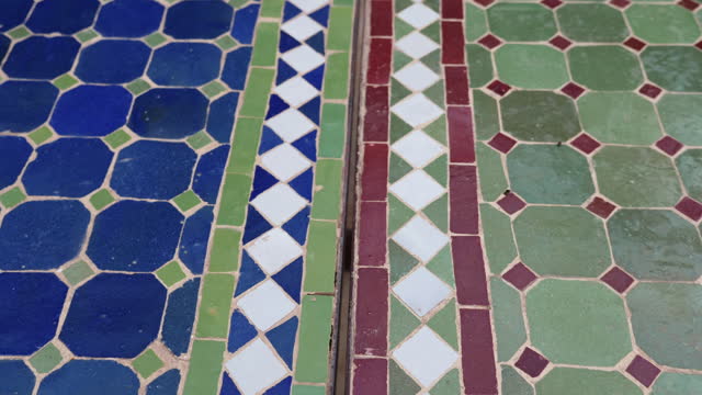 Moroccan tables with tiles in traditional mosaic design.
