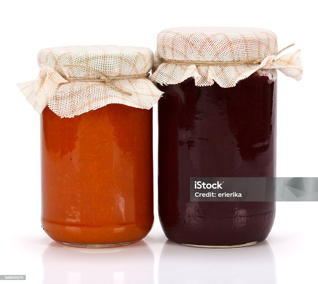 Plum and peach jam in glass jar Plum and peach jam in glass jar on white background Canned Food Stock Photo