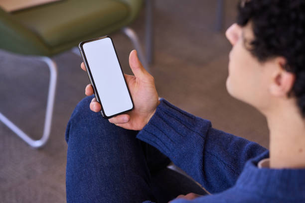 istock Hands holding modern smartphone. Blank white digital screen for graphic display. Mockup. Ad space 1688003145