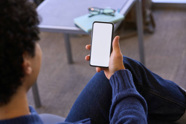 istock Man holding smartphone with blank copy space screen for your text message or information content 1688003150