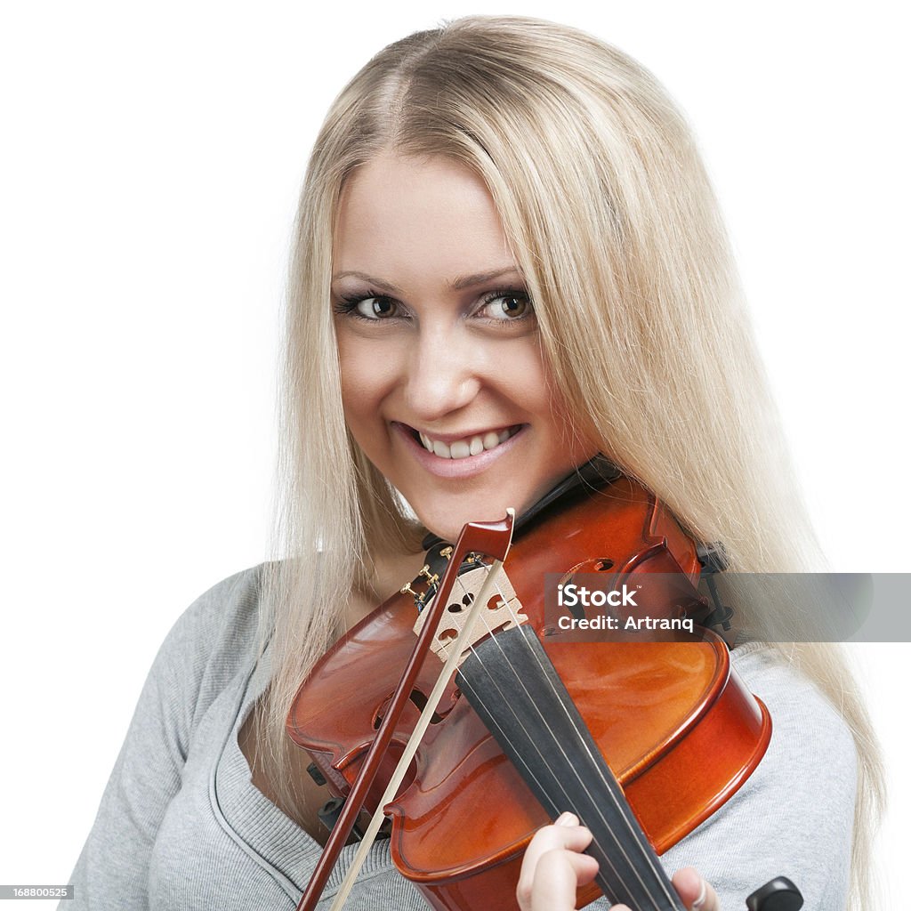 smiling woman playing the violin young smiling woman playing the violin Adult Stock Photo