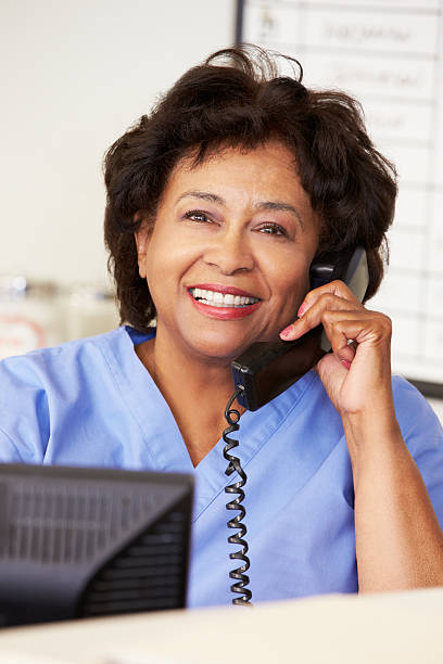 istock A nurse in blue making a phone call at the hospital  168800529