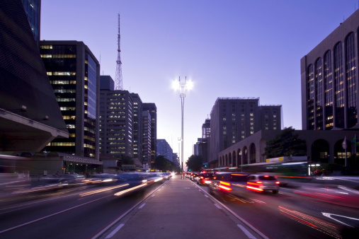Photo of Paulista Avenue, in Sao Paulo city, Brazil.  Blurred motion cars.