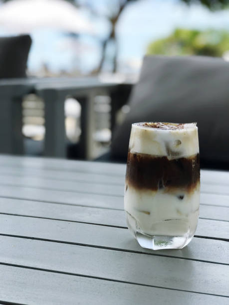 istock Iced coffee in glass on table in coffee shop with copy space 1688017180