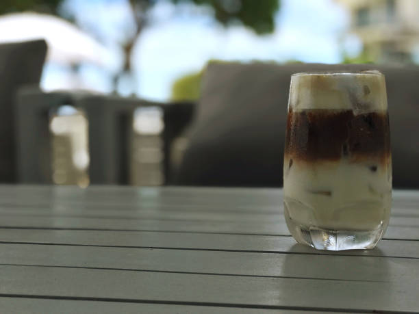 istock Iced coffee in glass on table in coffee shop with copy space 1688022005